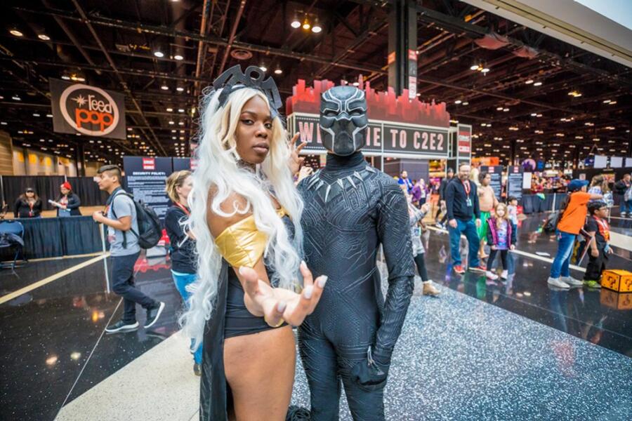 Two cosplayers at C2E2 dress up as Rogue and Storm.