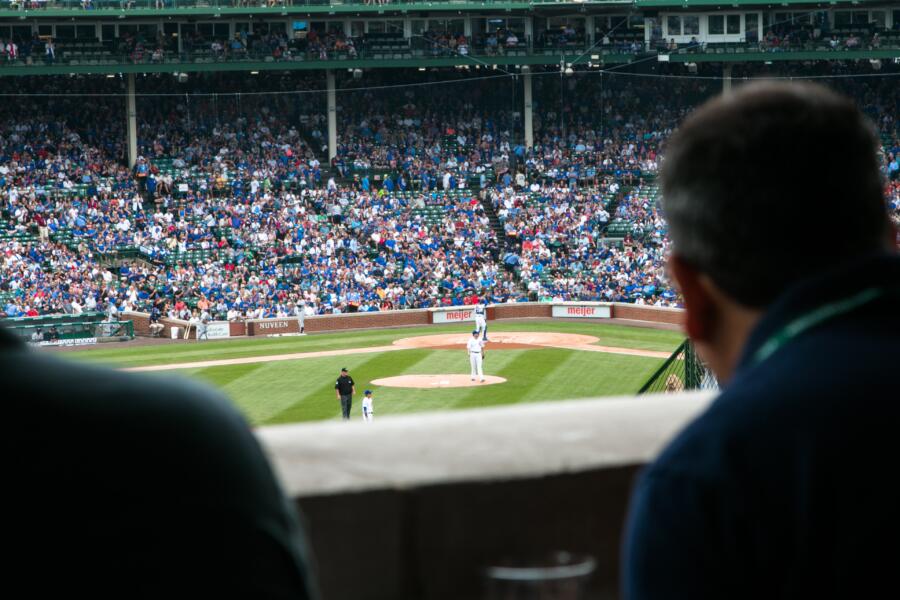 Sports fans take in a Chicago Cubs game during a gorgeous spring day in Chicago.