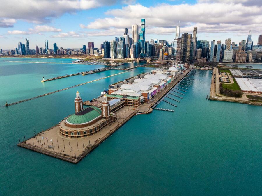 Aerial view of Navy Pier on a cloudy day with the beautiful city of Chicago in the background.